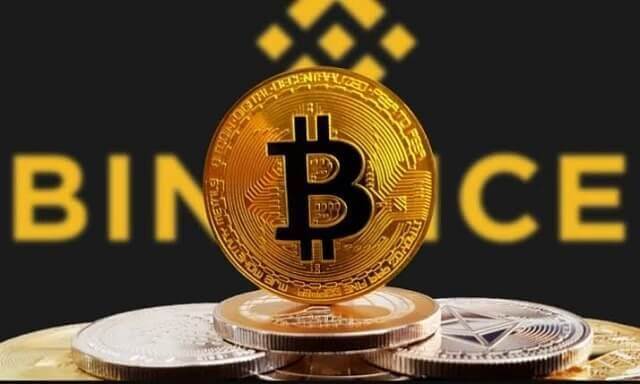 moeda de bitcoin e logo da exchange binance