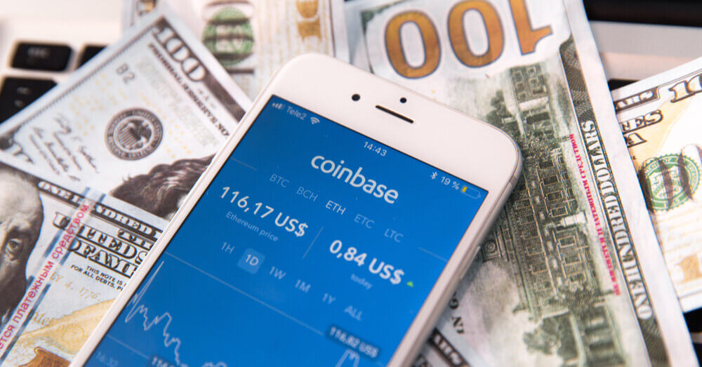 Uma imagem do site Coinbase e dólares