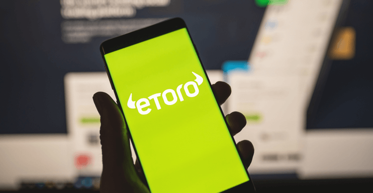 Uma imagem de uma tela de smartphone mostrando o logotipo do eToro